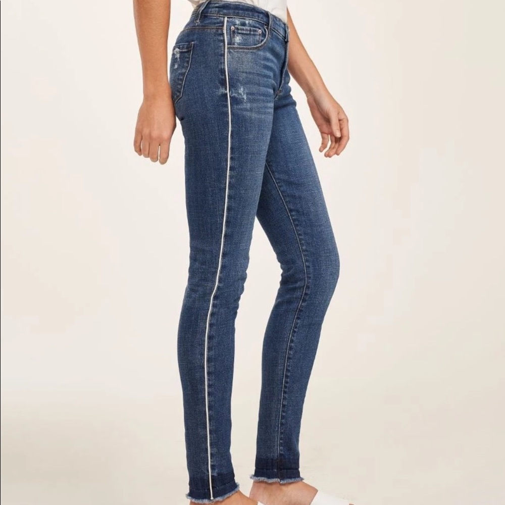 Blue jeans with white stripe